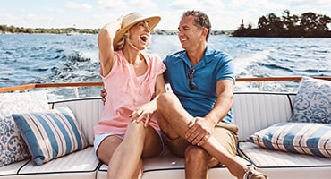 Couple laughing on boat