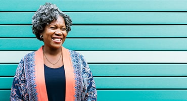 Woman smiling and looking into distance