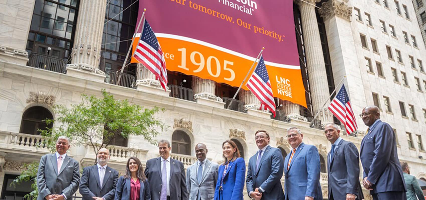 Leadership of Lincoln stands outside New York Stock Exchange on day they rand the closing bell