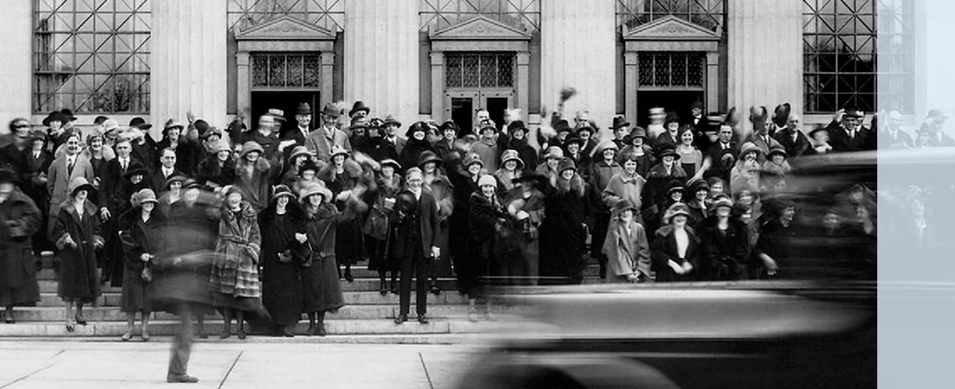 old photo of employees standing outside Lincoln Financial building