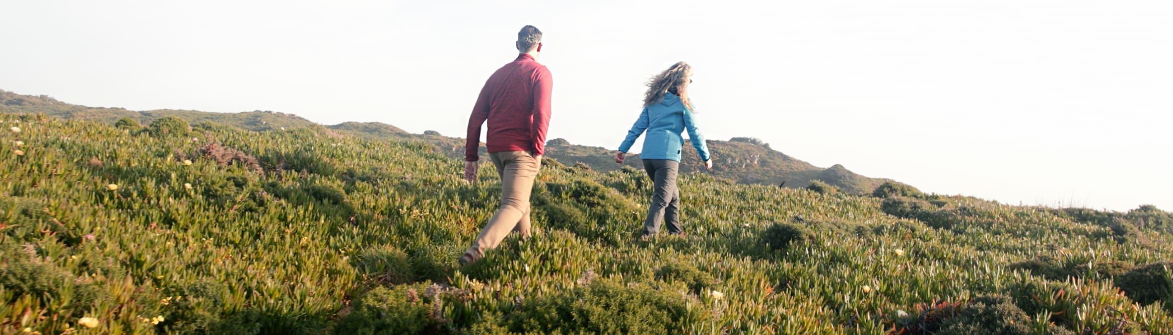 couple walking in field