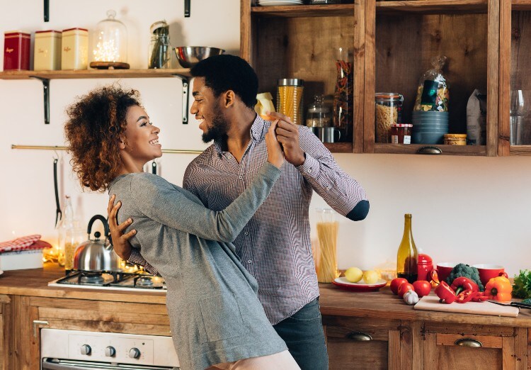 Couple dancing in kitchen