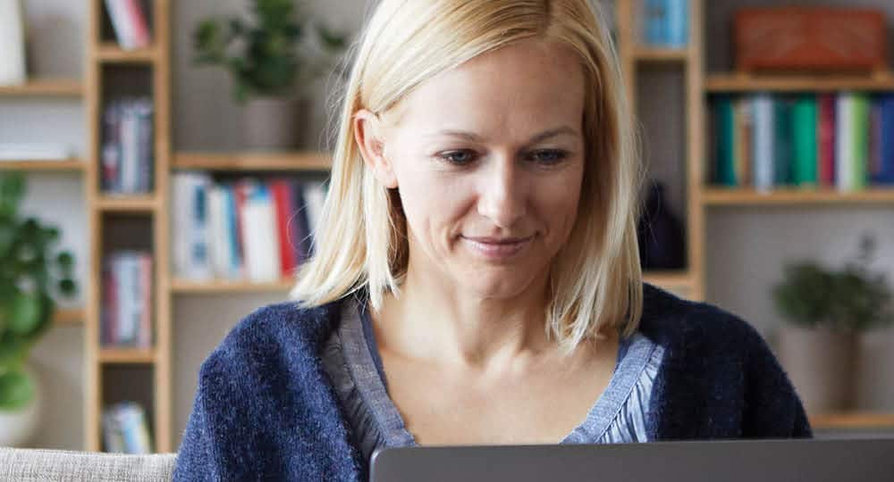 close up of woman working on computer