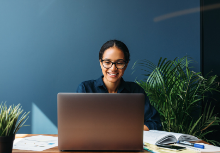 woman works on laptop in office