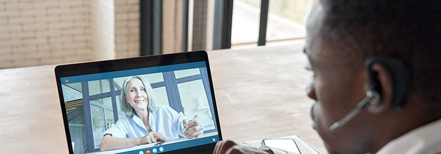 man having video conference call with woman from his laptop