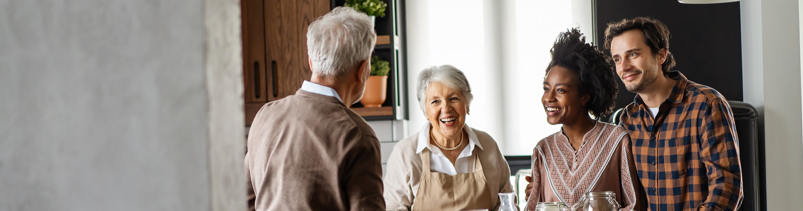 Family gathers around kitchen counter