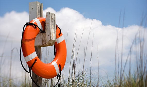life preserver ring hangs on pole