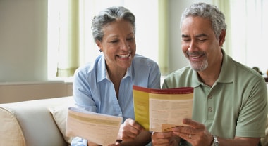 An older couple reviewing documents. 