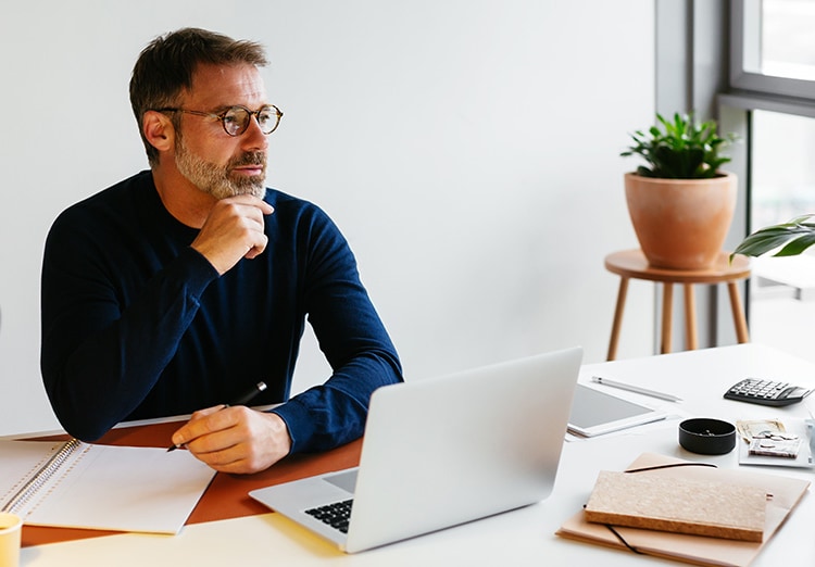 man works at desk