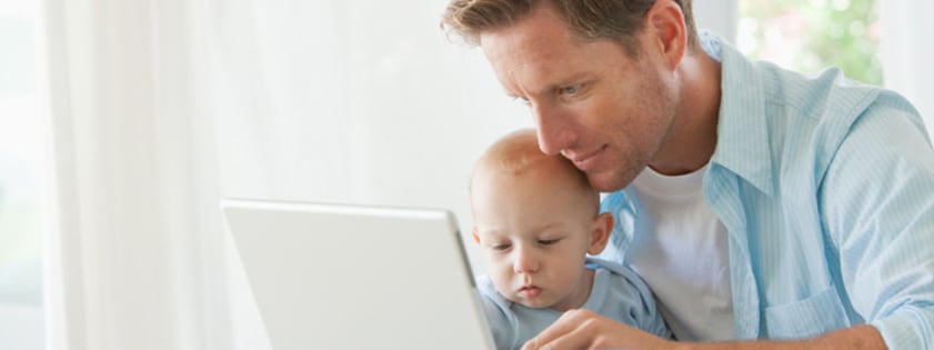 Man and baby on the computer