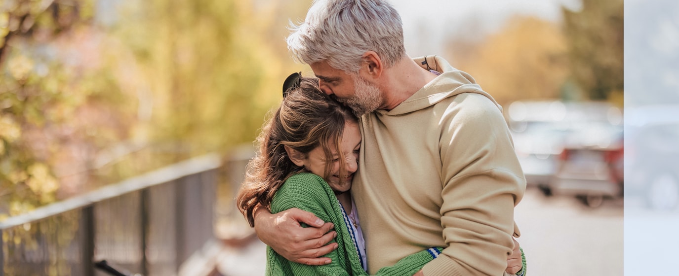father and daughter hugging