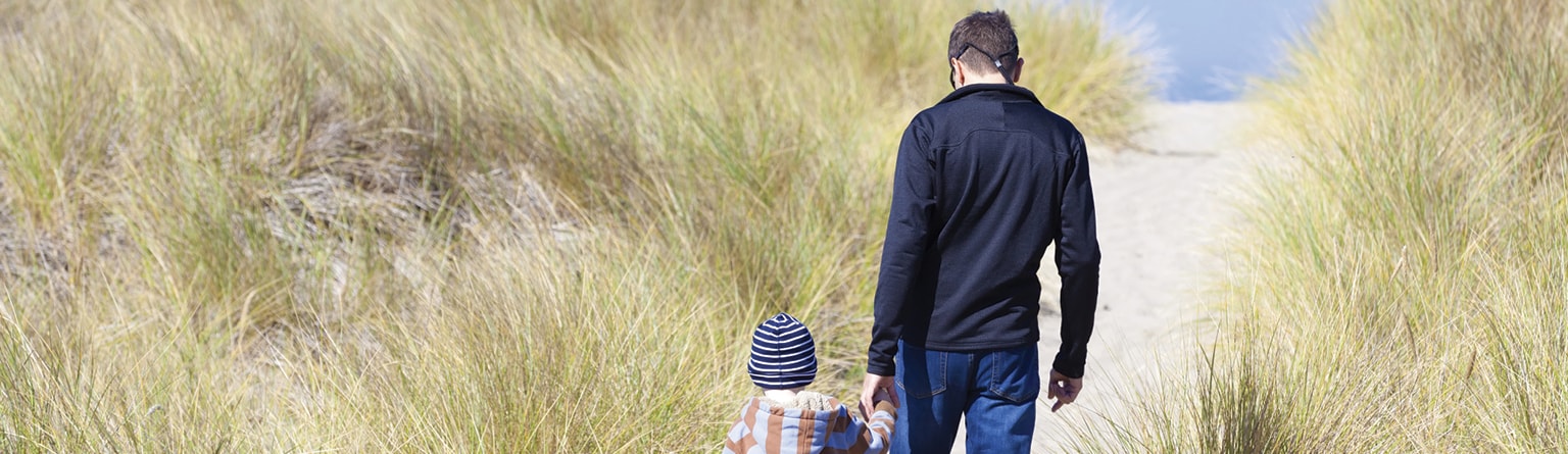 father and child walking