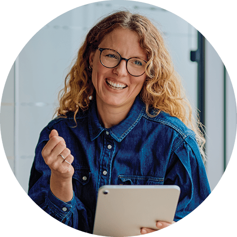smiling woman with a digital tablet
