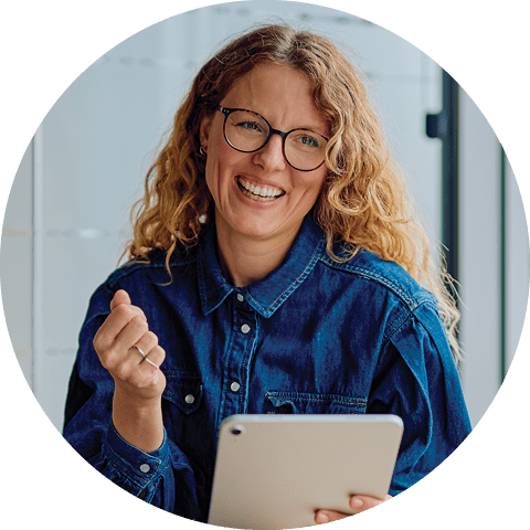smiling woman with a digital tablet