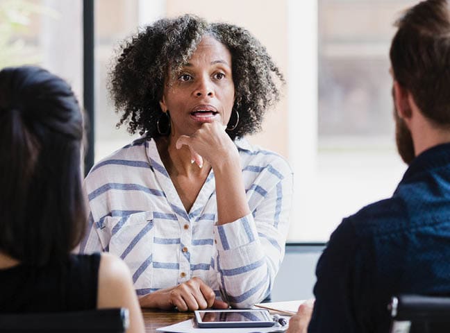 coworkers meeting around a table