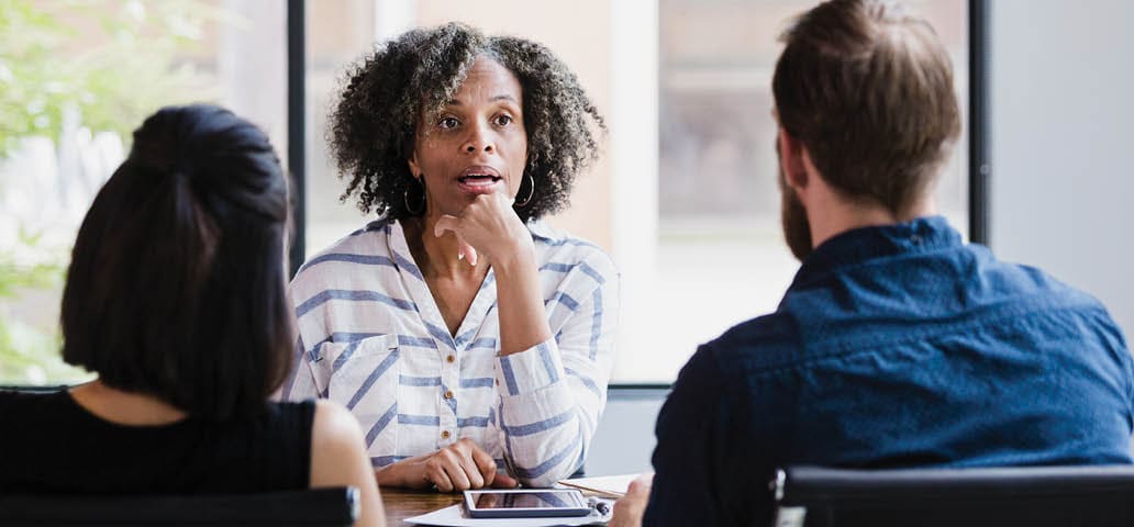 coworkers meeting around a table