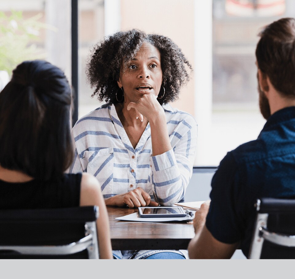 coworkers meeting around a table