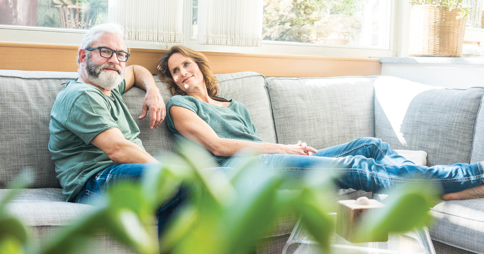 older couple sitting on a couch