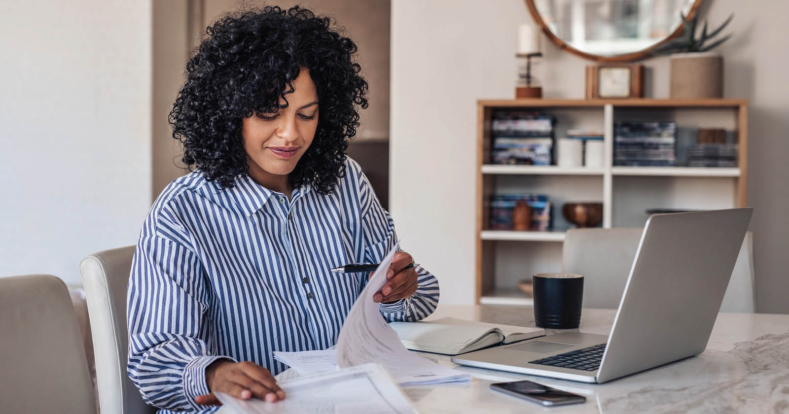 woman looking at paperwork