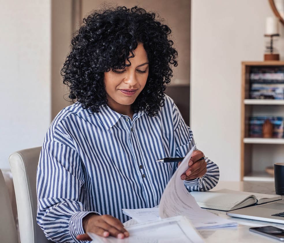 woman looking at paperwork