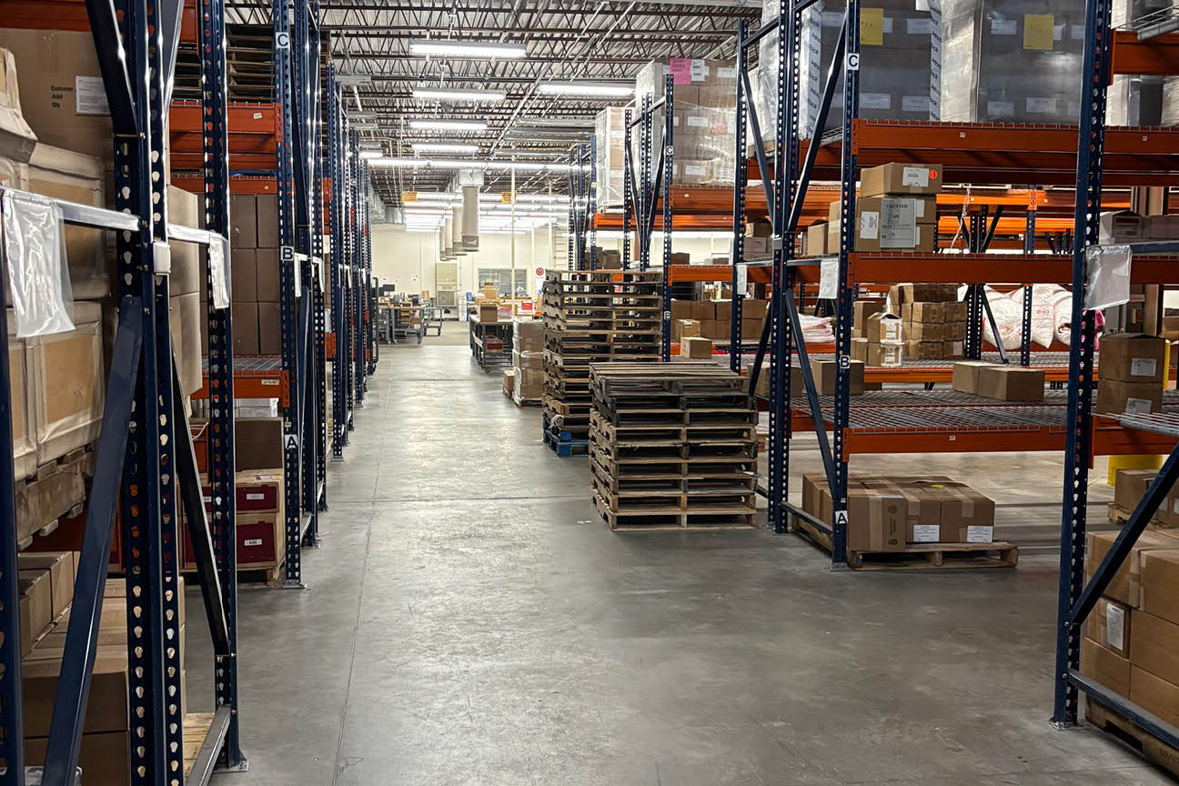 A large warehouse with shelves full of boxes and crates. AI generated content
