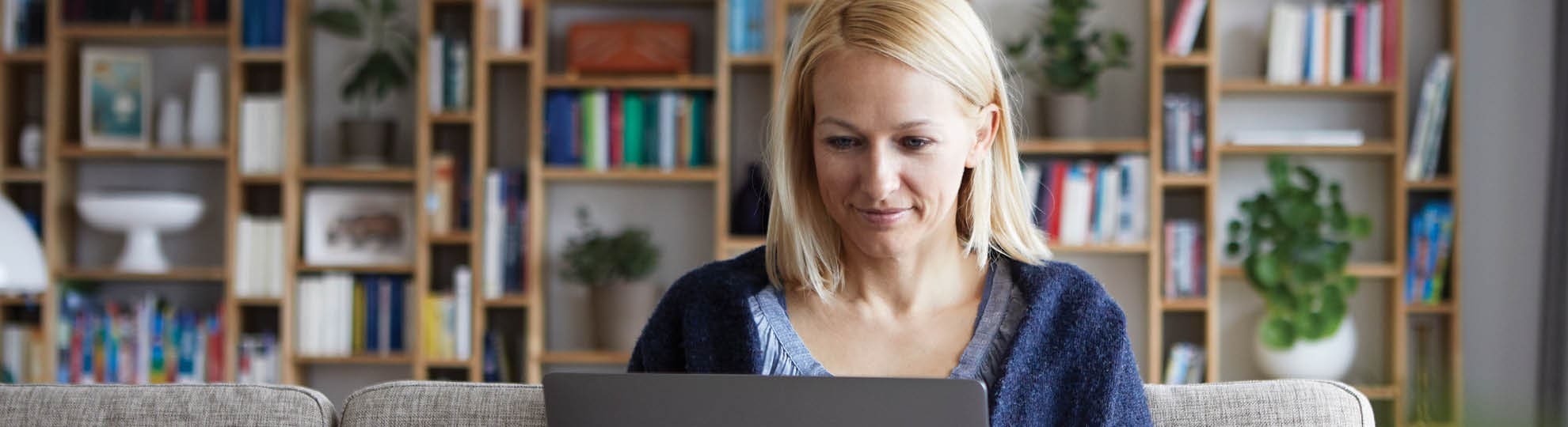 Woman submitting a LincXpress ticket on a computer