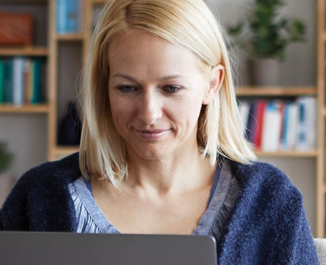 Woman submitting a LincXpress ticket on a computer