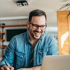 Man in glasses smiling 