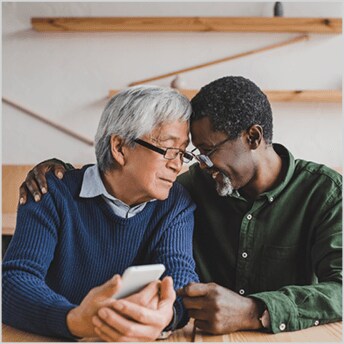 Image of older couple embracing.