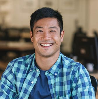A young man smiling