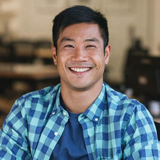 A young man smiling