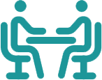 icon of two people sitting at a desk across from each other