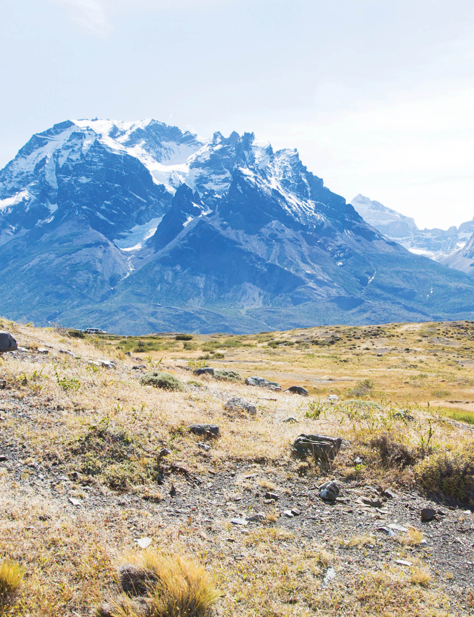 Father and son hiking and pointing at distant mountains