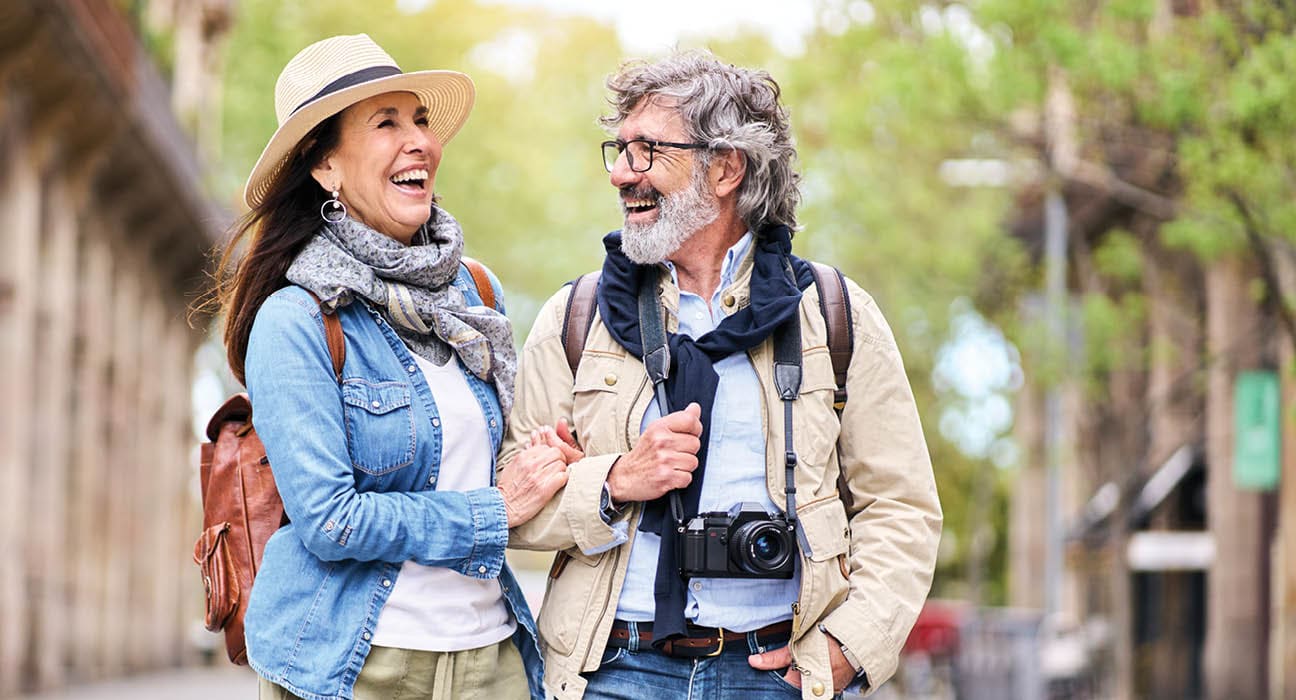 older couple walking arm in arm