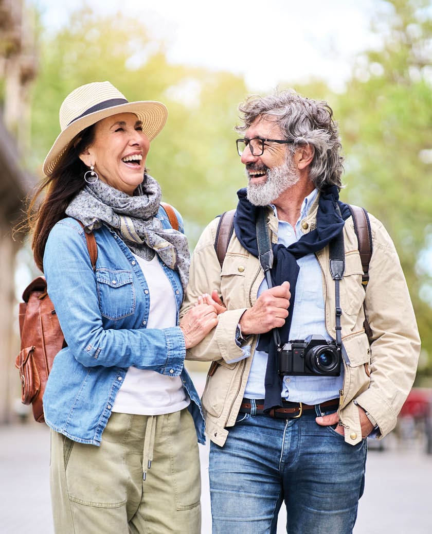 older couple walking arm in arm