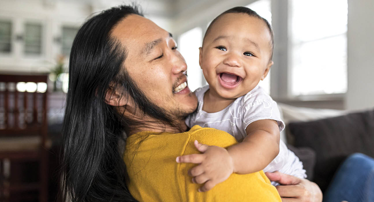 Father holds infant son