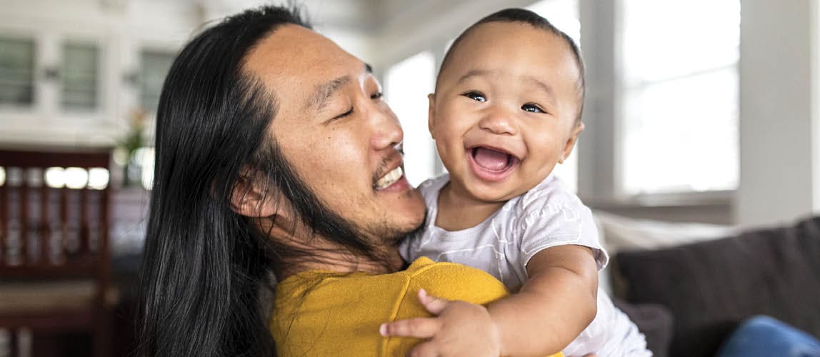 Father holds infant son