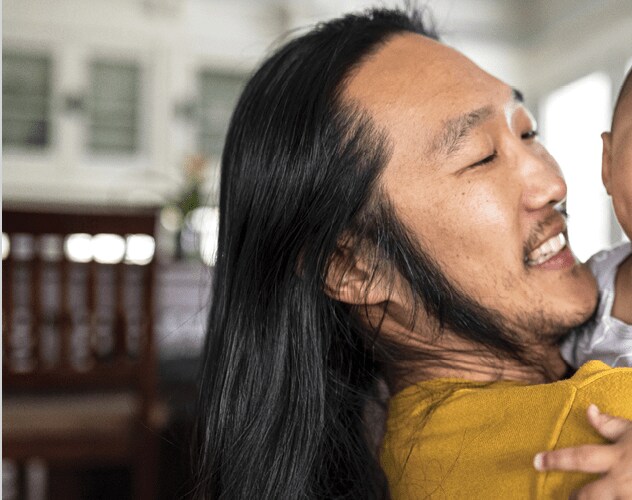 Father holds infant son