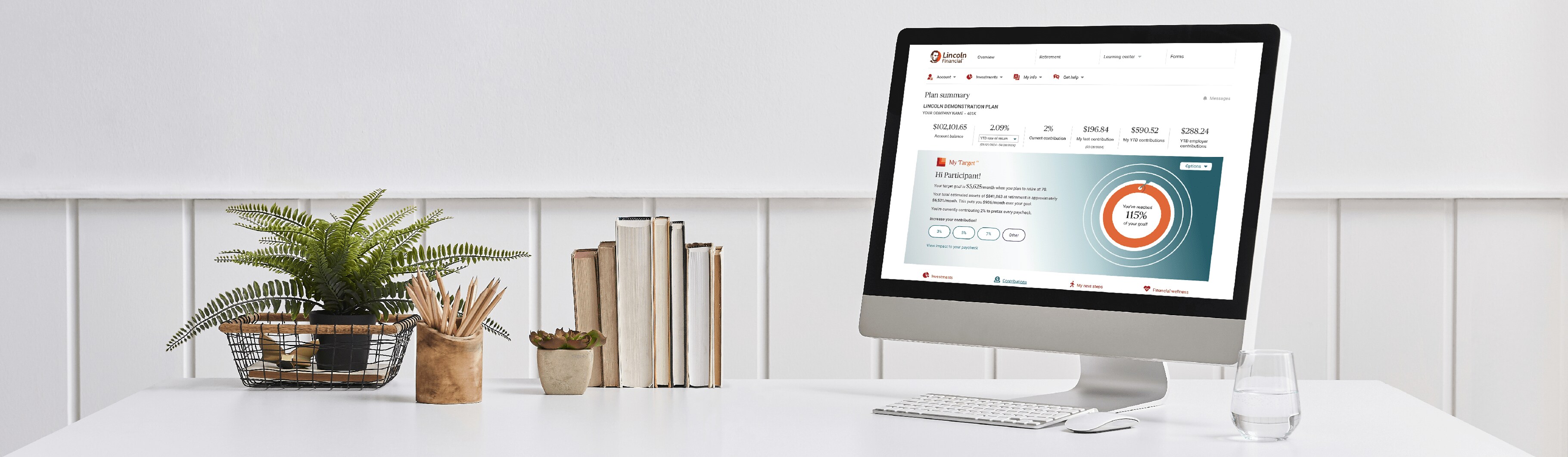 desktop computer with participant online account on screen