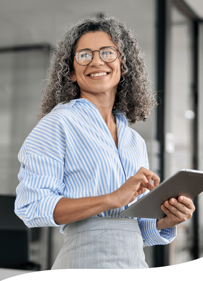 smiling woman holding an electronic tablet