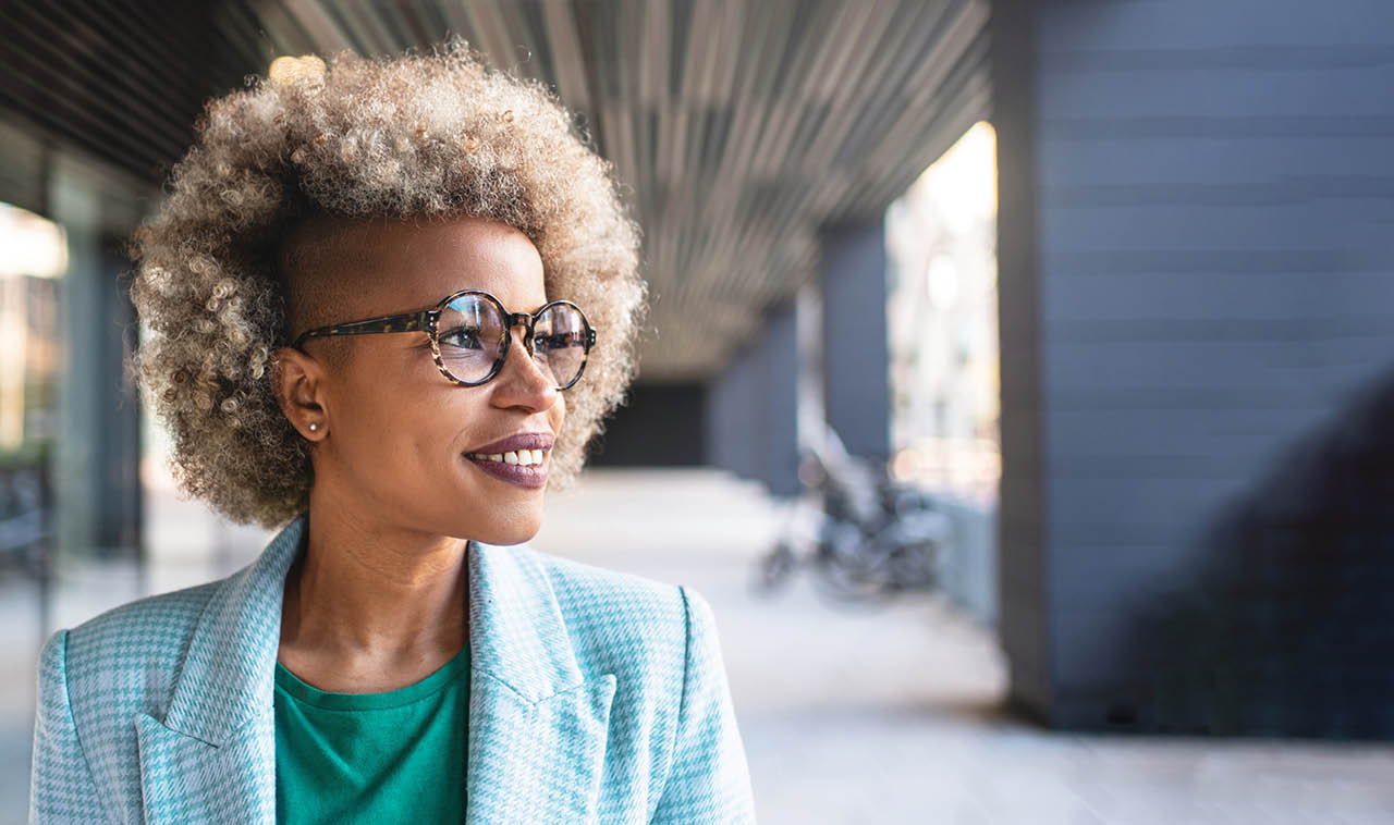 smiling woman looking off into the distance