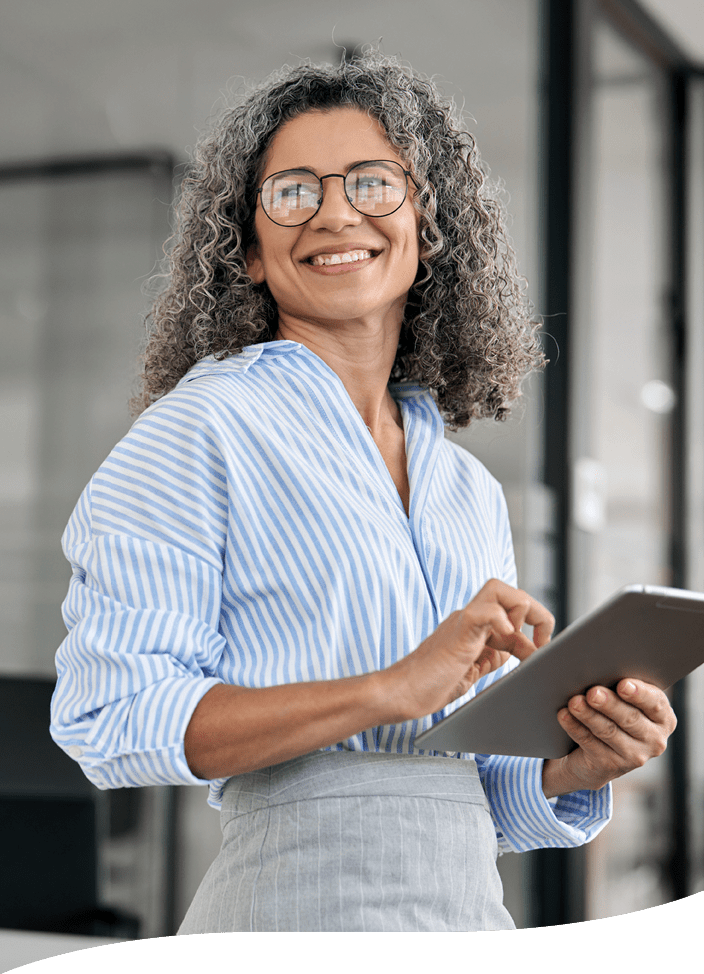 smiling woman holding an electronic tablet