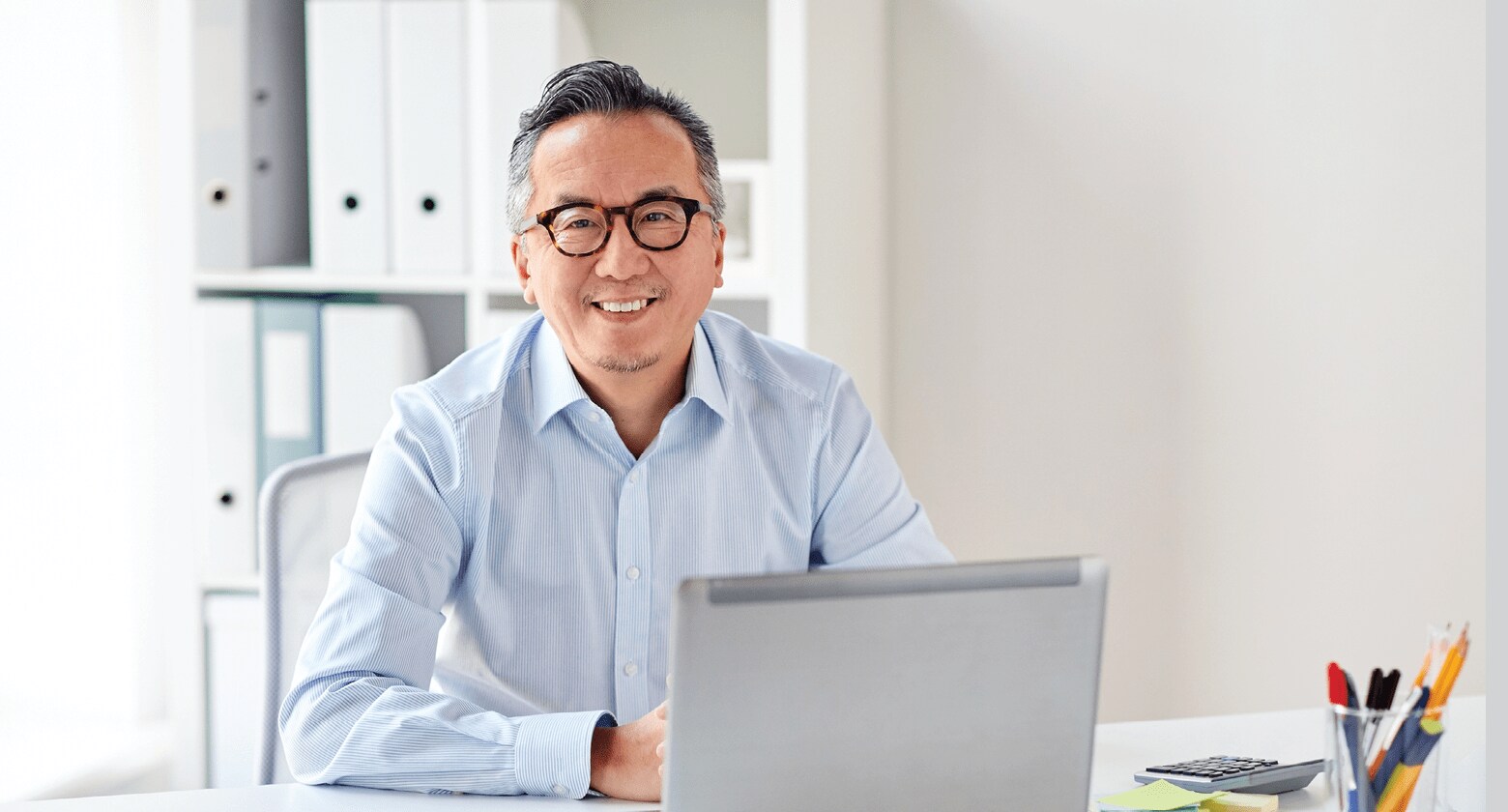 smiling businessman with laptop