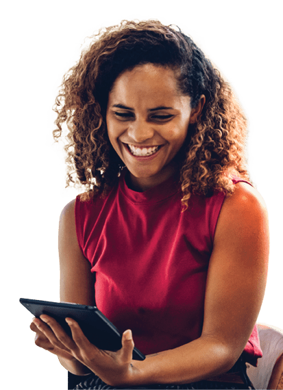Portrait of cheerful black skin african woman smiling and using tablet for video conversation while relaxing on desk in modern office. Concept of young business people working at home.