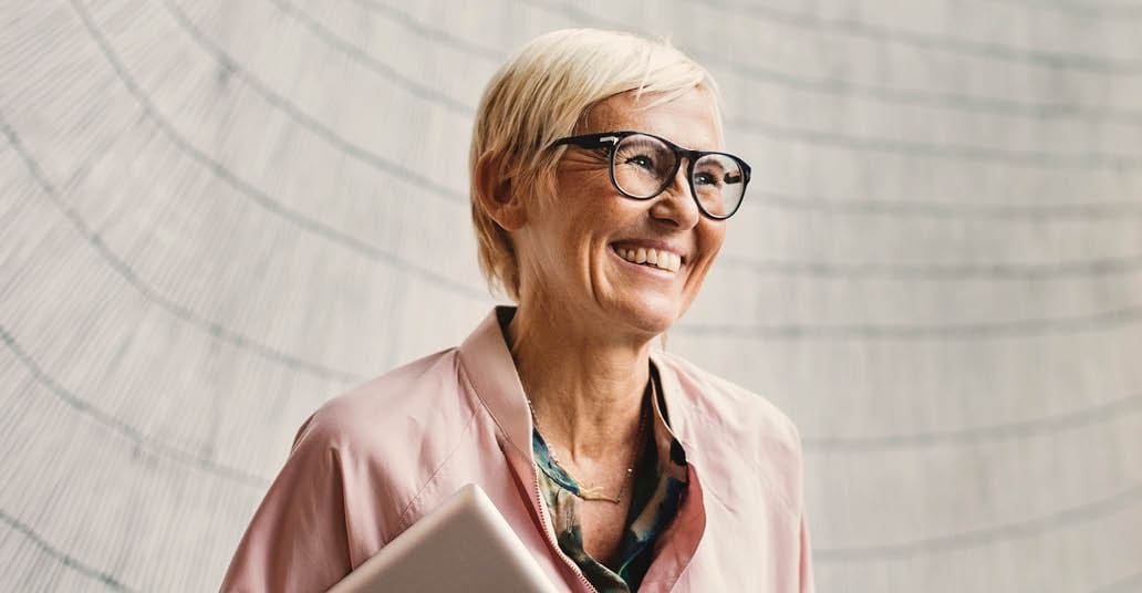 smiling woman with laptop
