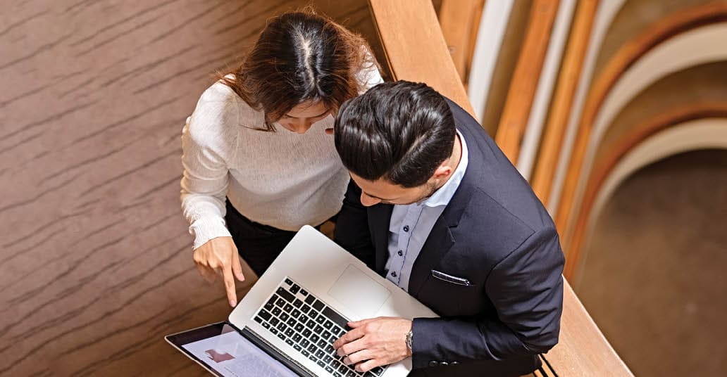 a business man and woman having a meeting