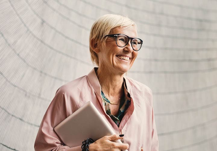 smiling woman with laptop