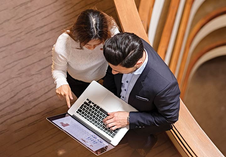 a business man and woman having a meeting